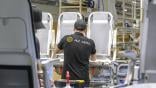 Technician working on aircraft seats